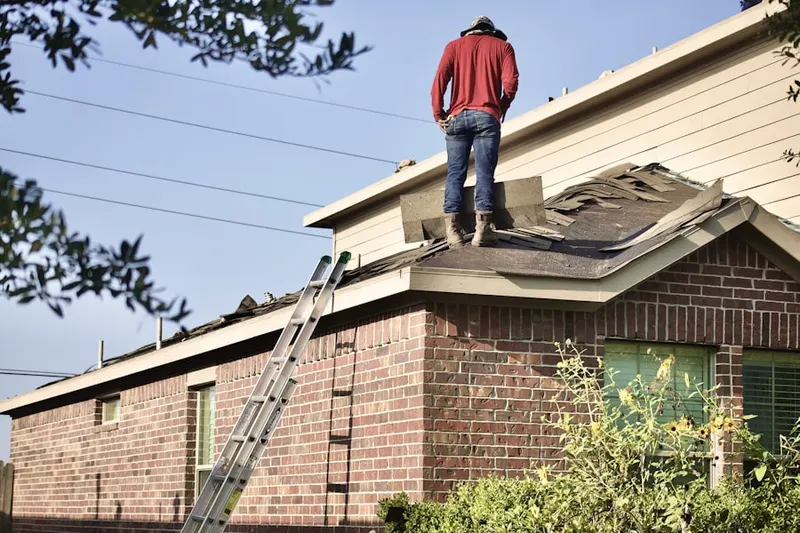 Professional roofer working on a residential roof in Horizon West